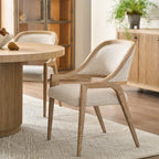 Wooden chair and dining table in a room with wooden cabinets and a rug.
