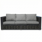 Gray sofa with wicker frame on a white background