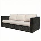 Outdoor sofa with black frame and beige cushions on a white background