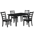 Black dining table set with four chairs on a white background