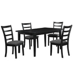Black dining table set with four chairs on a white background