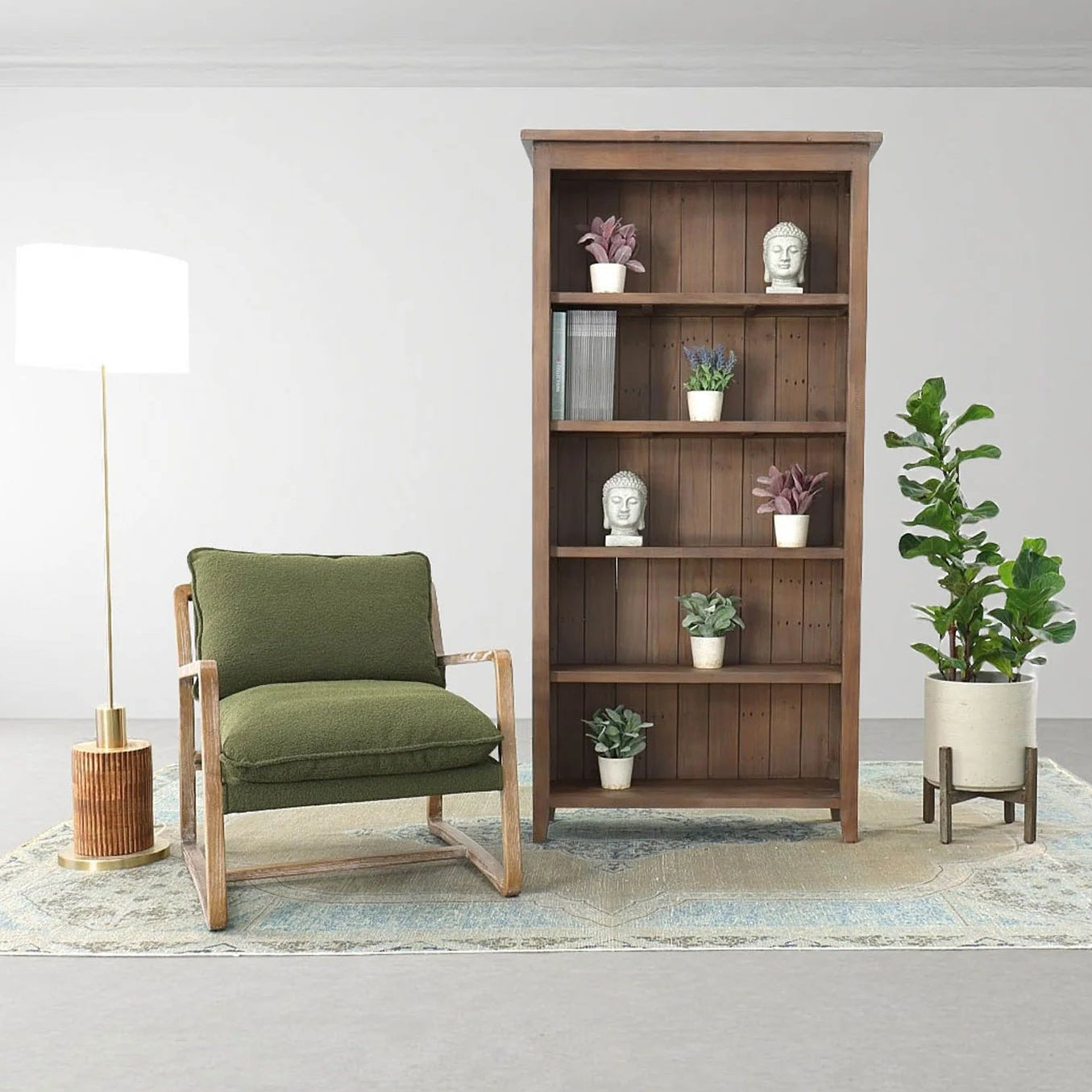 A green club chair with a wooden frame, placed in a room setting with a bookcase, potted plants, and a lamp in the background.