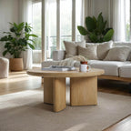 Modern living room with a wooden coffee table, white sofa, and plants.