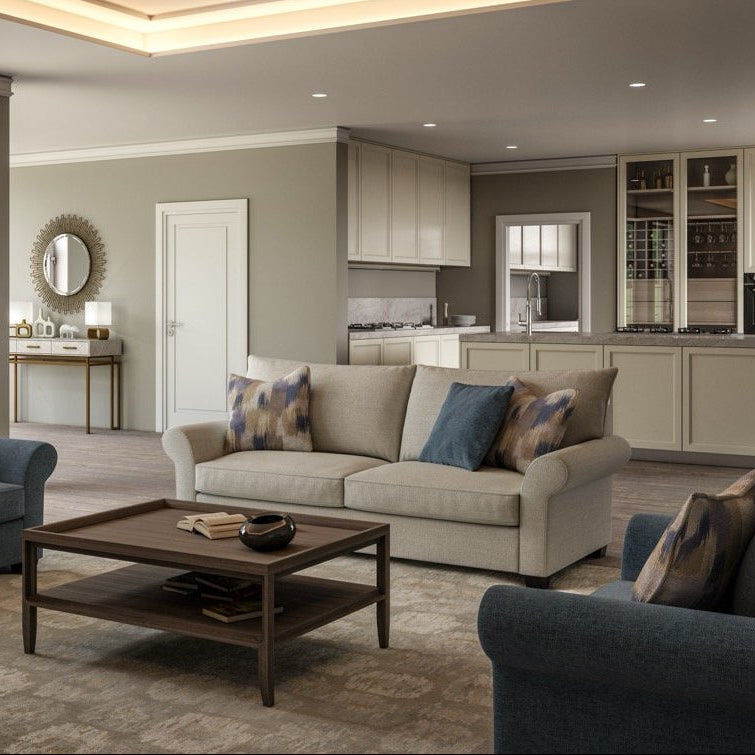 Modern living room with gray sofa, wooden coffee table, and kitchen in the background.