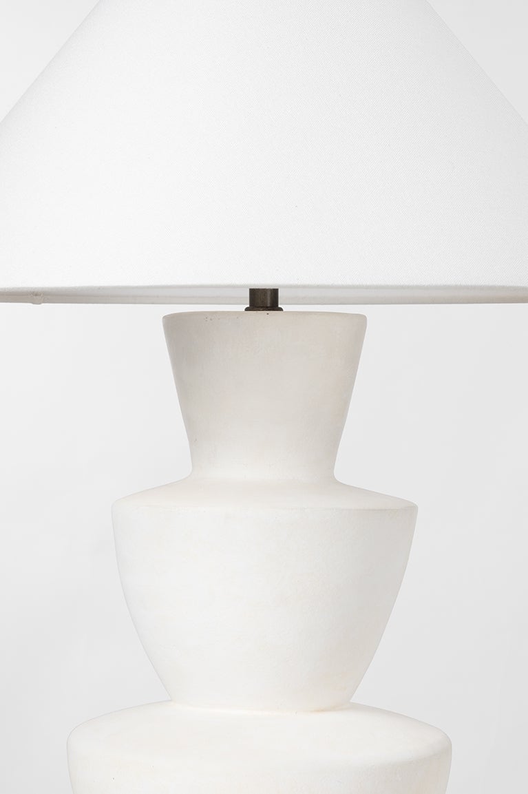 Kamas Stacked Ceramic Table Lamp in Ivory Texture styled in a room