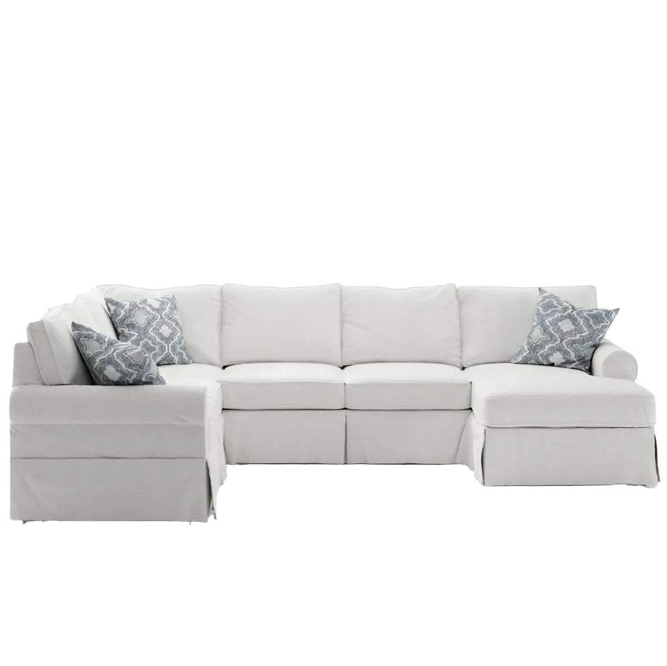 Gray sectional sofa with patterned cushions on a white background