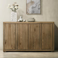 Wooden sideboard with decorative items on a neutral wall background