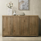 Wooden sideboard with decorative items on a neutral wall background