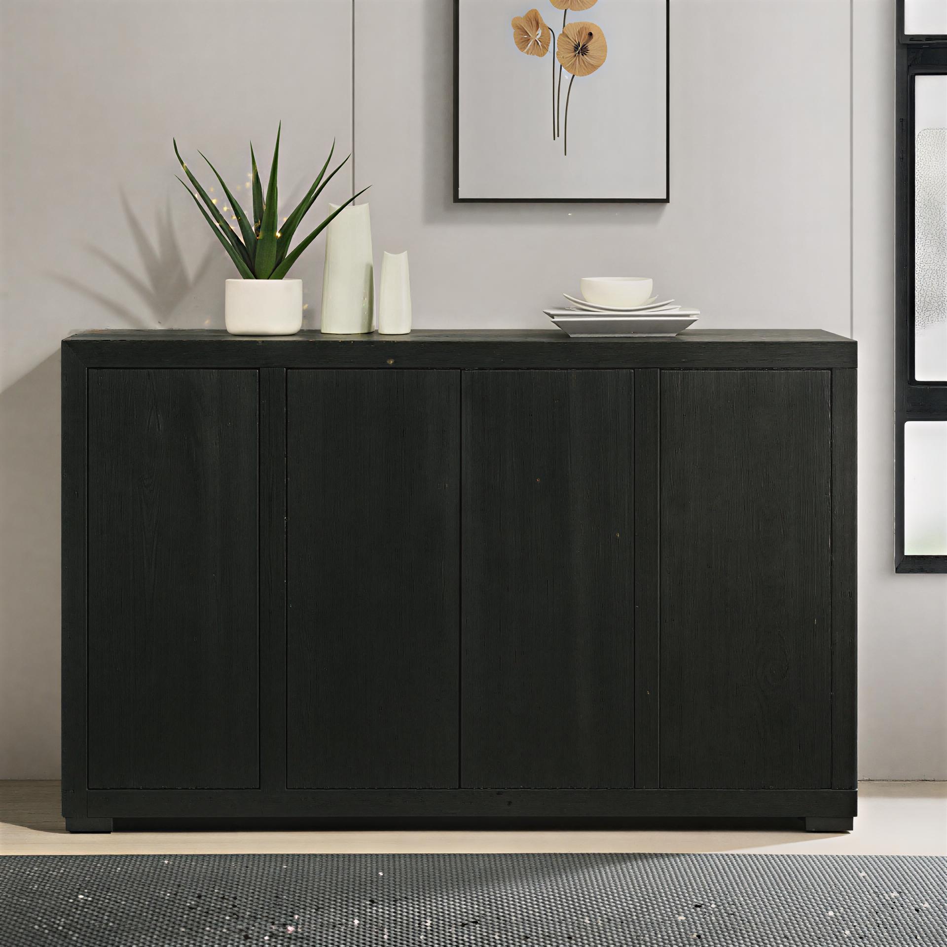 Black sideboard with decorative items in a room setting