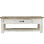 Wooden coffee table with a white painted base on a white background