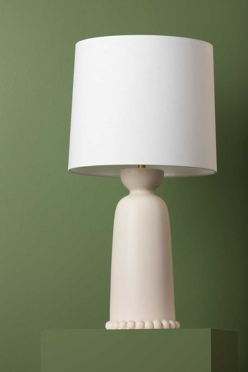Rhea Ceramic Table Lamp styled in a room