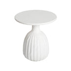 White round side table with textured base on a white background
