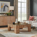 Living room with a wicker coffee table and decorative items.