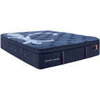 Blue mattress with 'Stearns & Foster' branding on a white background