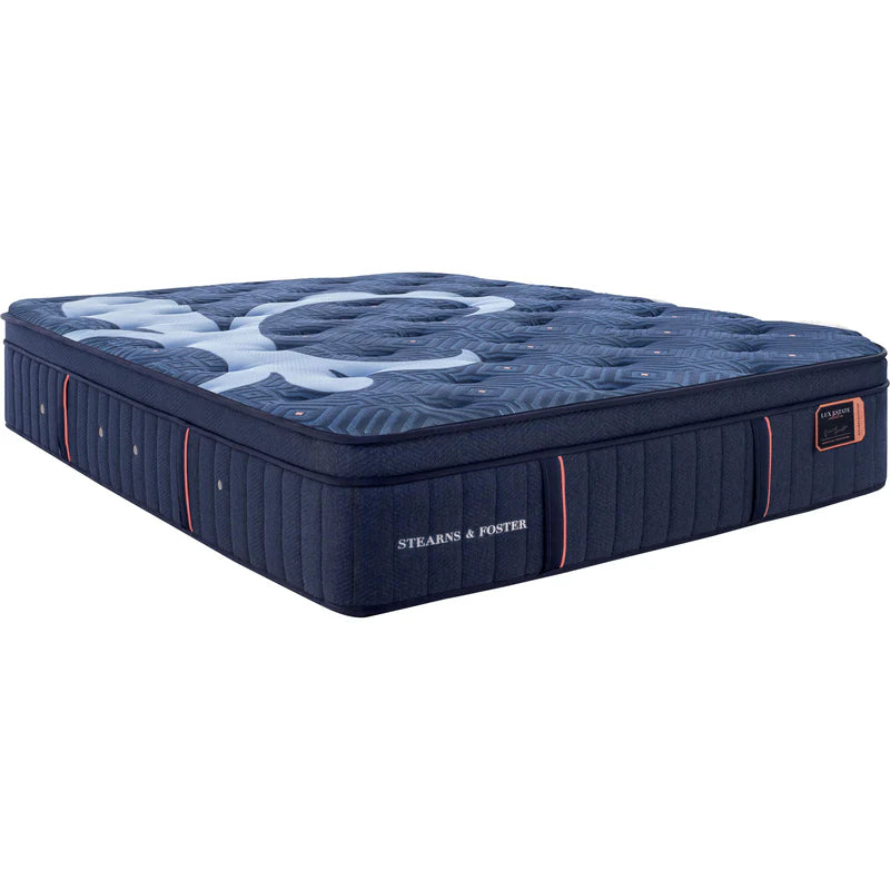 Blue mattress with 'Stearns & Foster' branding on a white background