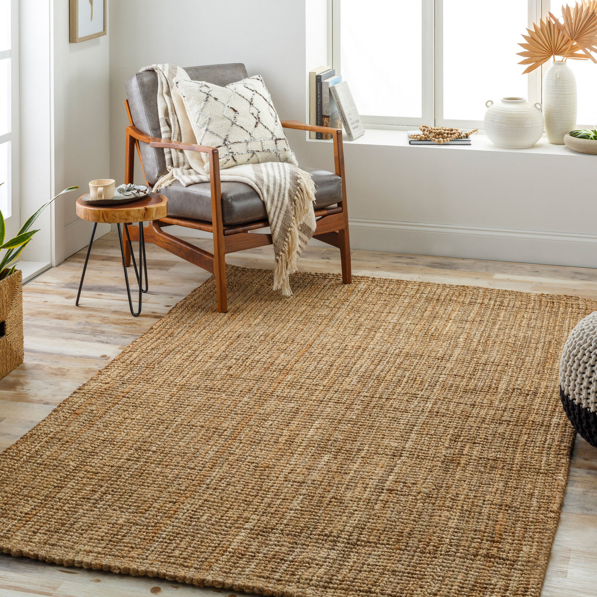 Calla Hand-Woven Jute Rug styled in a room