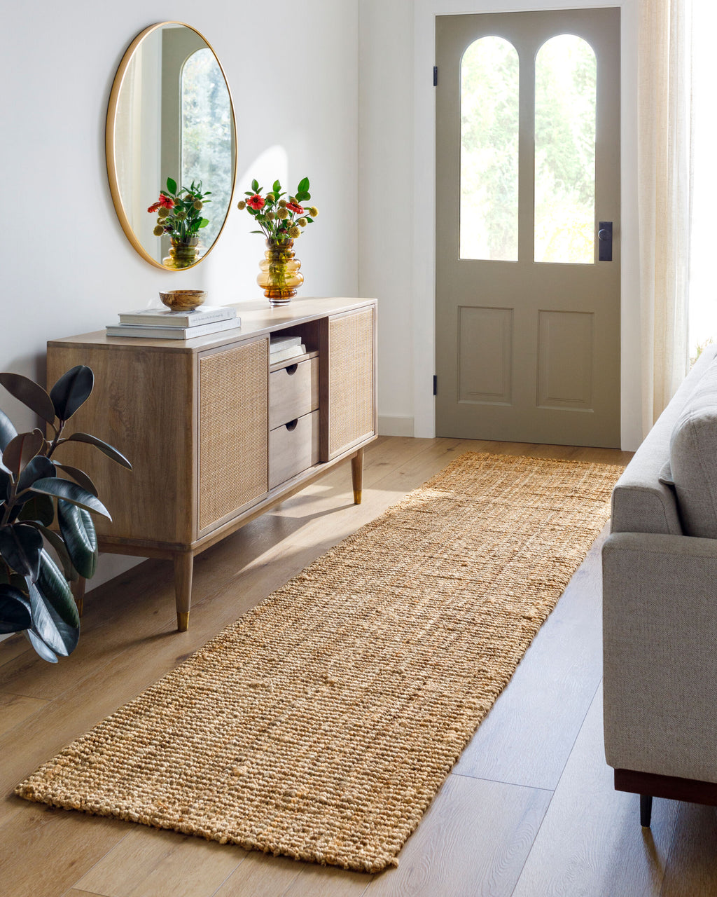 Calla Hand-Woven Jute Rug styled in a room