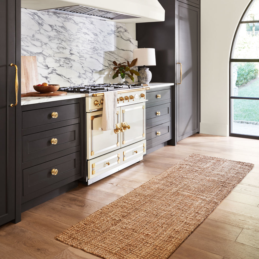 Calla Hand-Woven Jute Rug styled in a room