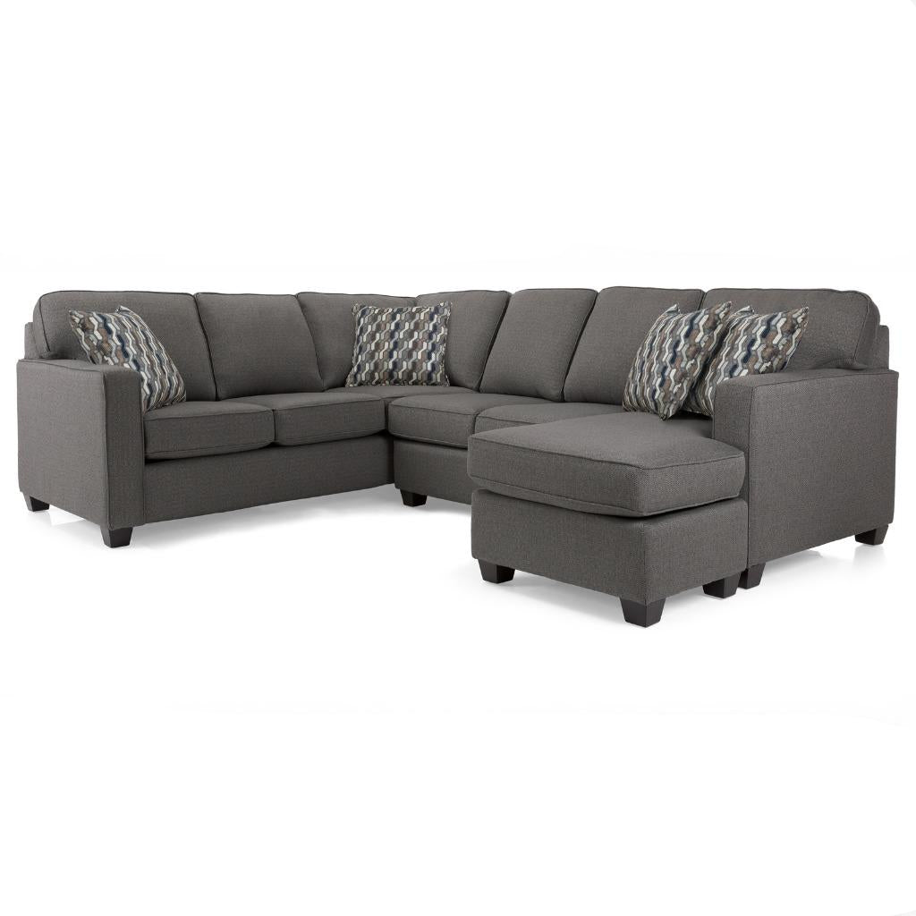 Gray sectional sofa with patterned cushions on a white background