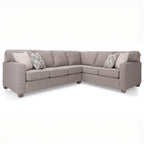 Beige sectional sofa with cushions on a white background