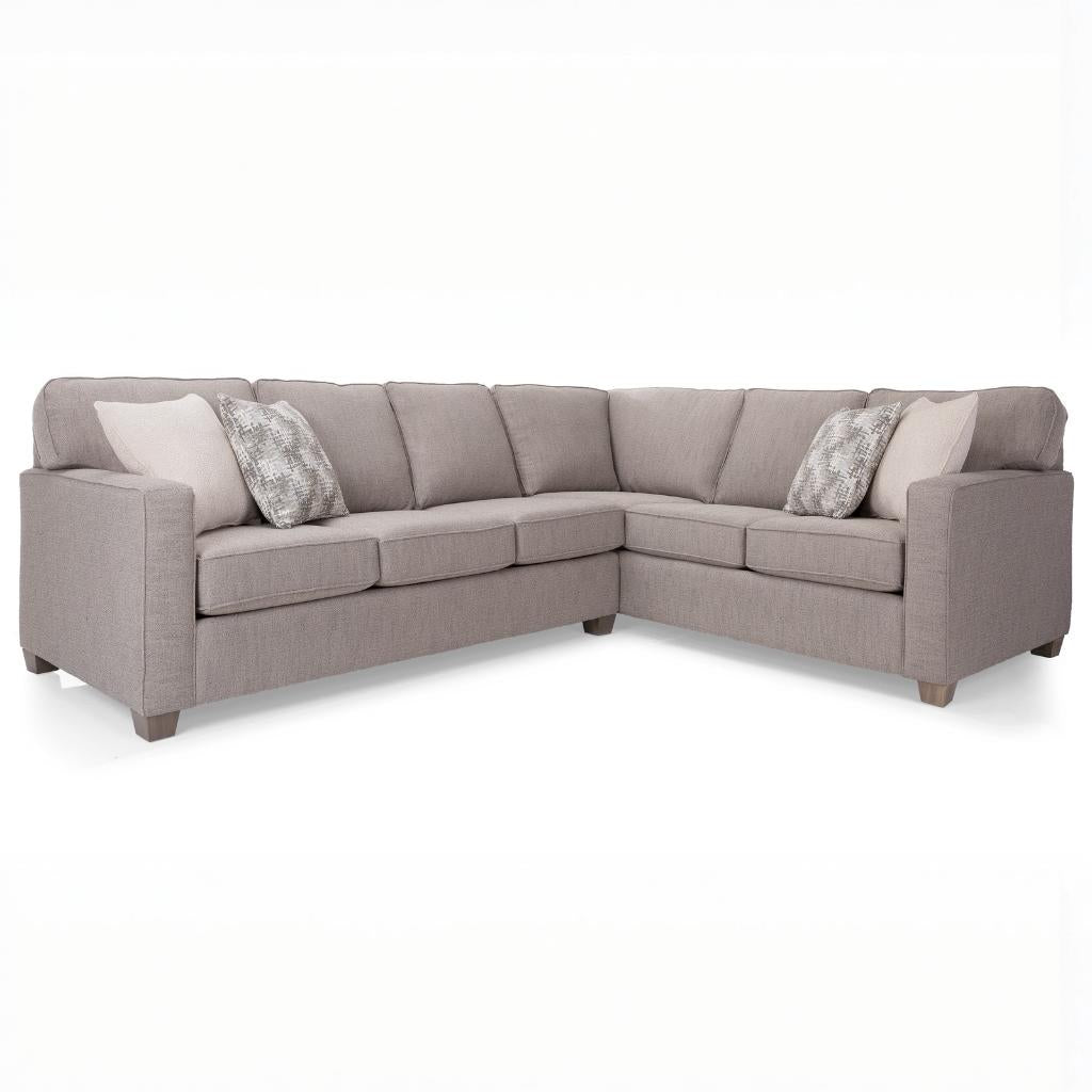 Beige sectional sofa with cushions on a white background