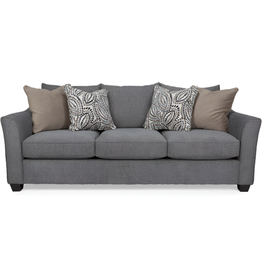 Gray sofa with patterned and solid cushions on a white background