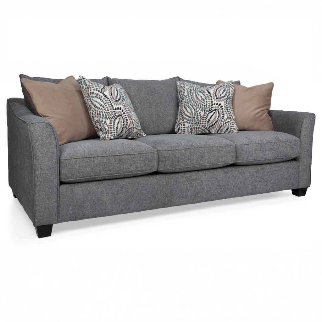 Gray sofa with patterned and solid color cushions on a white background