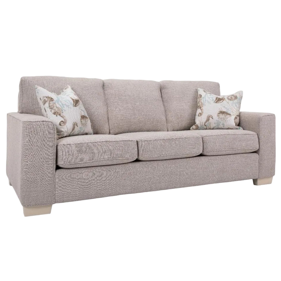 Beige sofa with patterned cushions on a white background