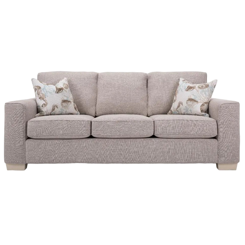 Beige sofa with patterned cushions on a white background