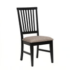 Black wooden chair with a beige cushion on a white background