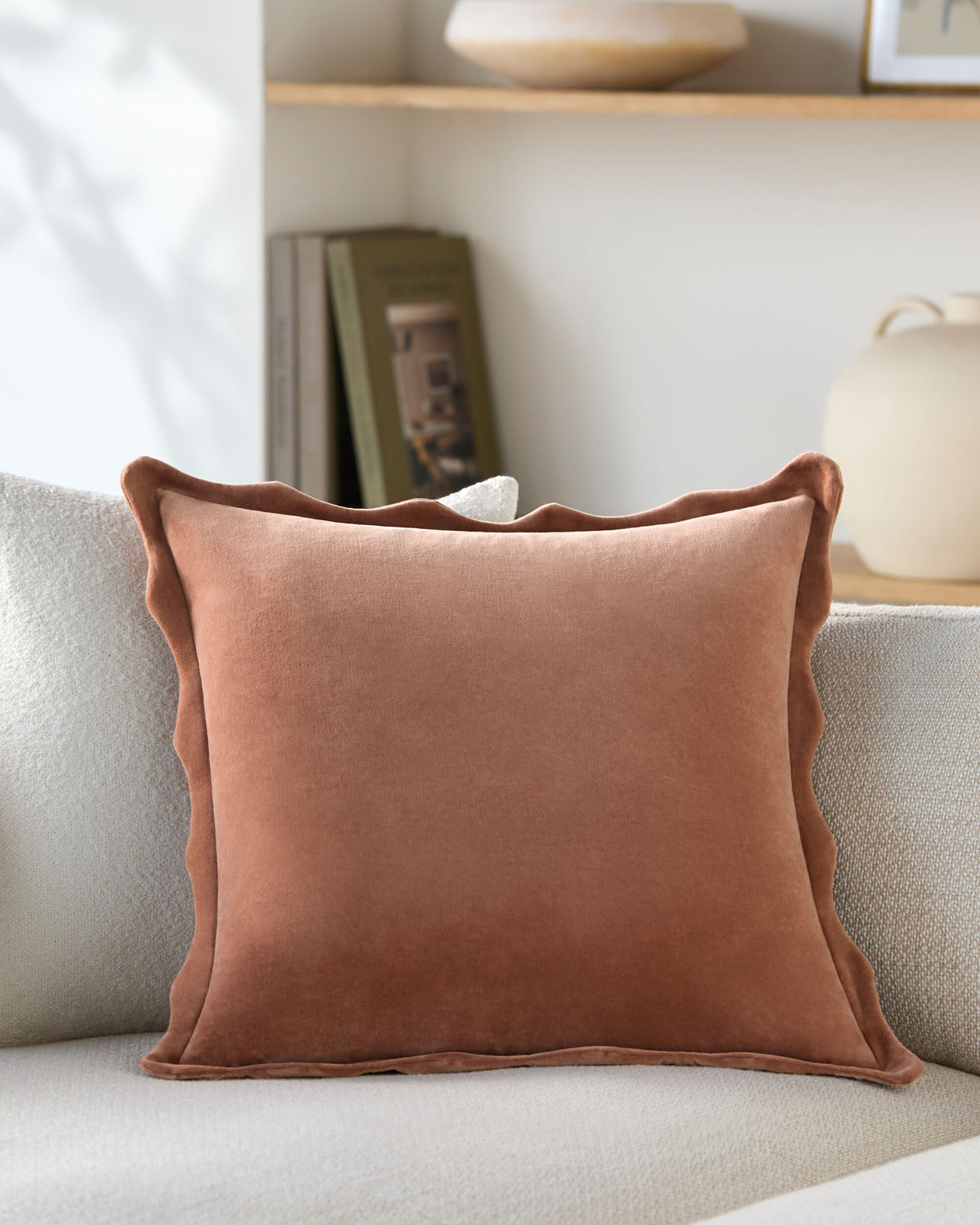 Effervescent Scalloped Pillow styled on a sofa