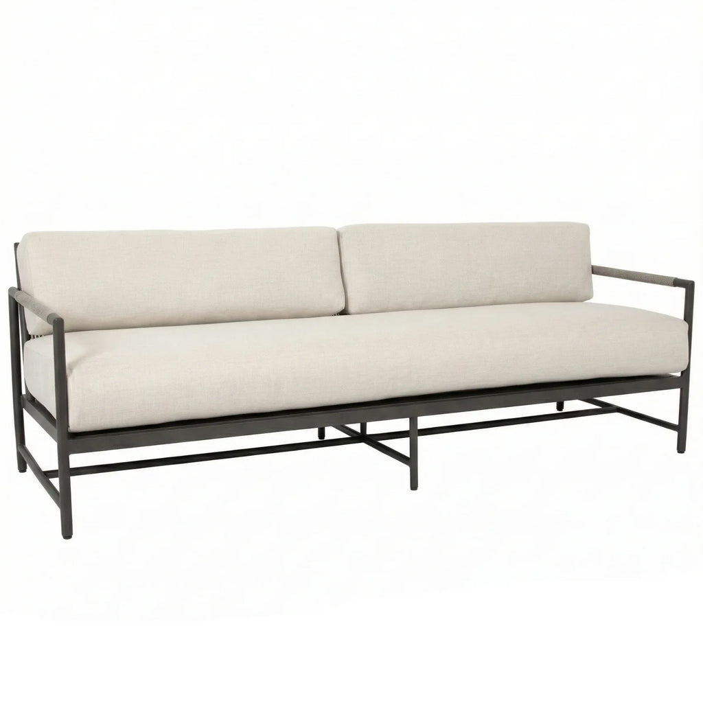 Beige sofa with metal frame on a white background