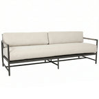 Beige sofa with metal frame on a white background