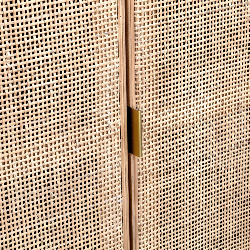 Close-up of a woven beige panel with a gold handle
