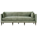 Green velvet sofa on a white background