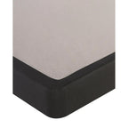 Corner of a mattress boxspring on a white background