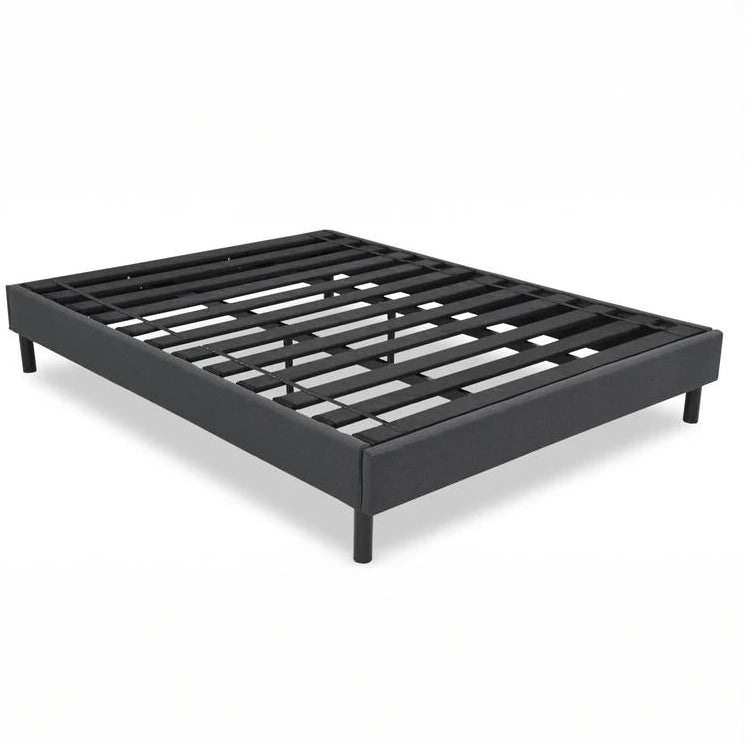Black metal bed frame on a white background